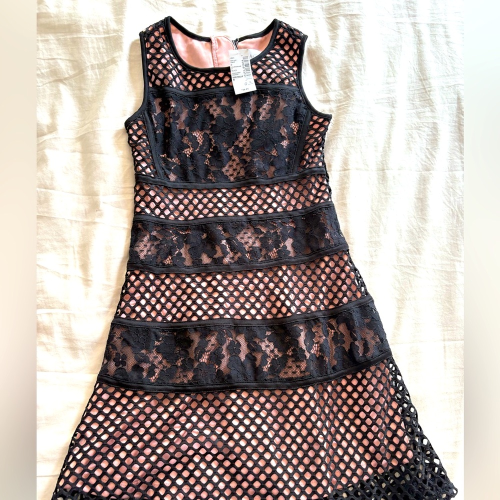 Brand New. Tags on. Children’s Place. Size 8. Pretty Black and Pink Lace Dress..